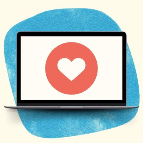 Laptop showing a heart icon against a background of blue watercolor
